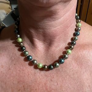 Beautiful earthy tones of pearls on a choker type necklace. Clasp is magnetic.